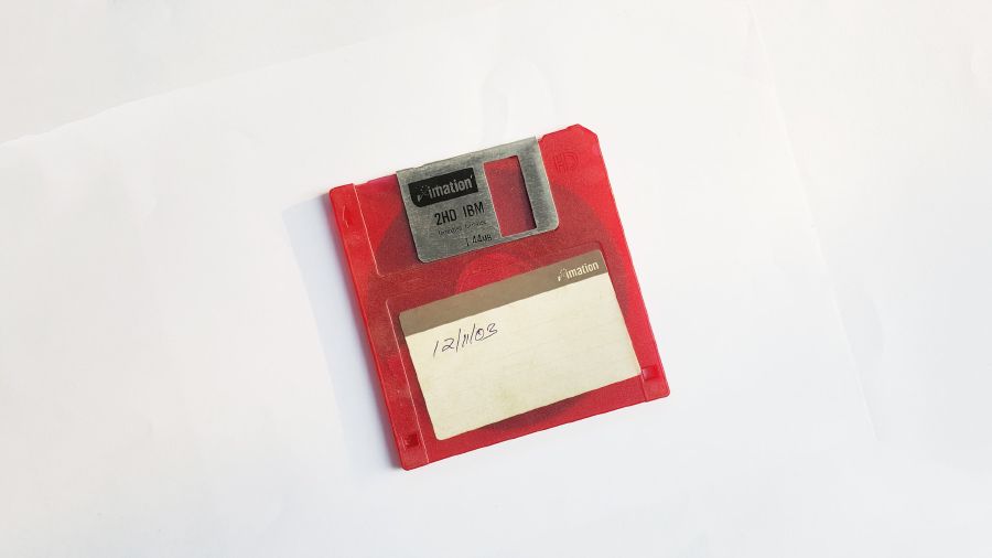 Red floppy disk labled with the date 12/11/03