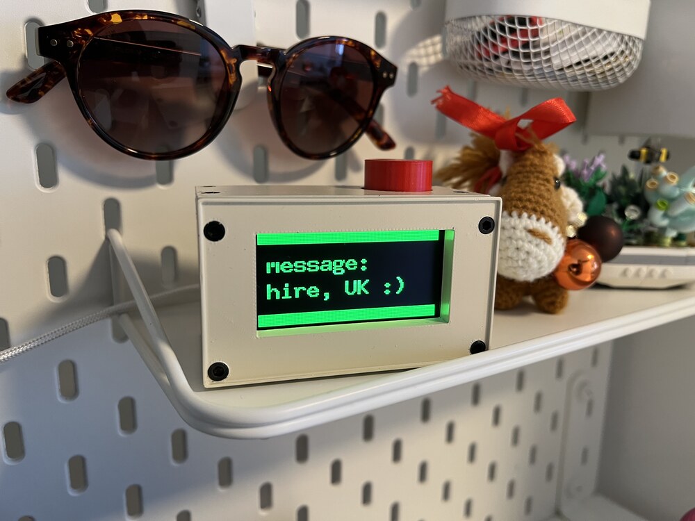 Retro cube showing "hire, UK :)" which is the last part of a message that did not quite fit on the screen and was a greeting from the UK.